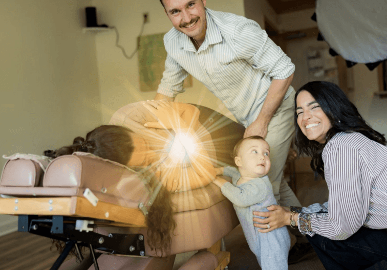 Dr. Cameron with patient at Shine Family Chiropractic